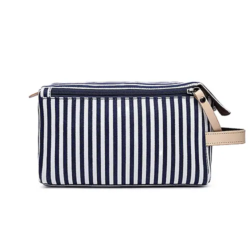 Spacious interior of striped canvas shaving bag for retail display and luxury gift sets